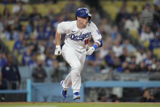 Los Angeles Dodgers' Will Smith (16) runs on a single during the first inning of a baseball game.