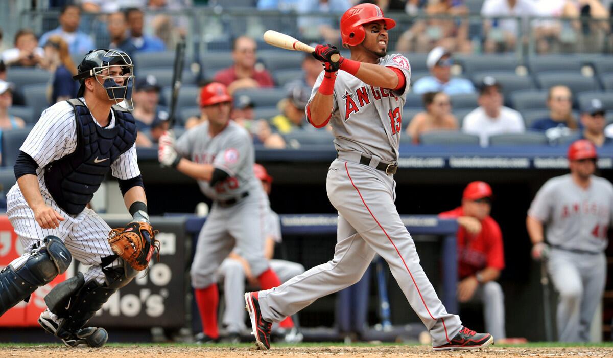 Former Los Angeles Angels infielder Maicer Izturis swings for a two-run home run against the New York Yankees on July 15, 2012.
