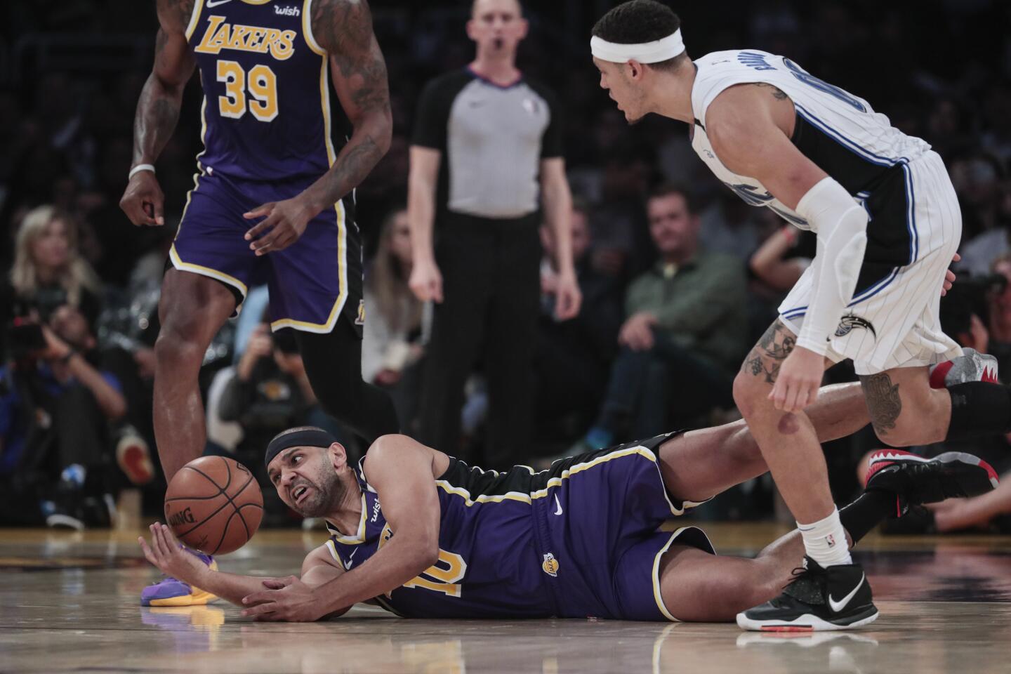 Lakers forward Jared Dudley dives for a loose ball during the first half.