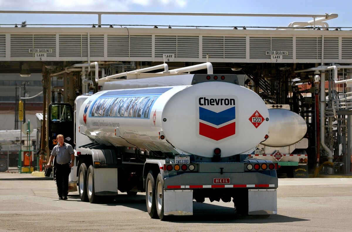 A tanker prepares to load up at Chevron's massive refinery in Richmond, Calif.