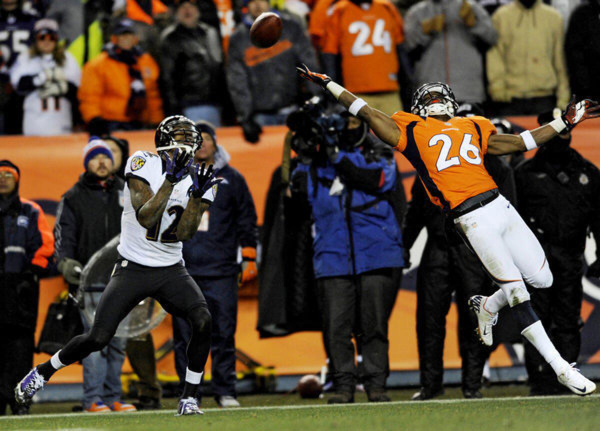 Denver Broncos defensive back Rahim Moore (26) gets beat by Baltimore Ravens wide receiver Jacoby Jones for a game-tying 70-yard touchdown.