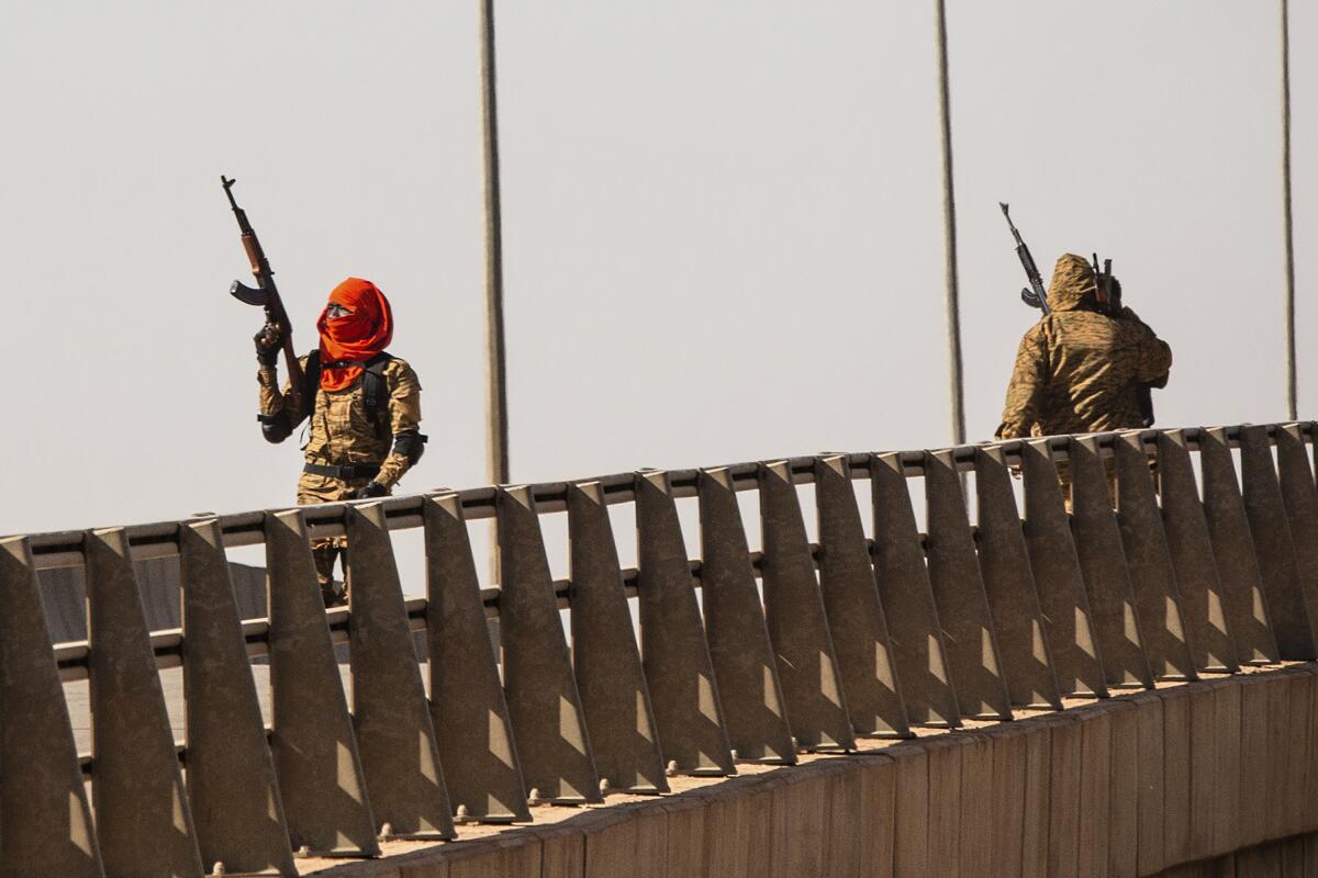 Soldiers on overpass