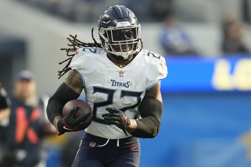 Tennessee Titans running back Derrick Henry (22) runs against the Los Angeles Chargers during the first half of an NFL football game in Inglewood, Calif., Sunday, Dec. 18, 2022. (AP Photo/Ashley Landis)