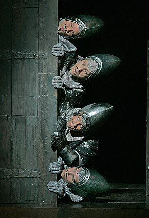 "Monty Python's Spamalot" at the Ahmanson Theatre features French guards played by Lenny Daniel, top, Christopher Sutton, Rick Holmes and David Havasi.