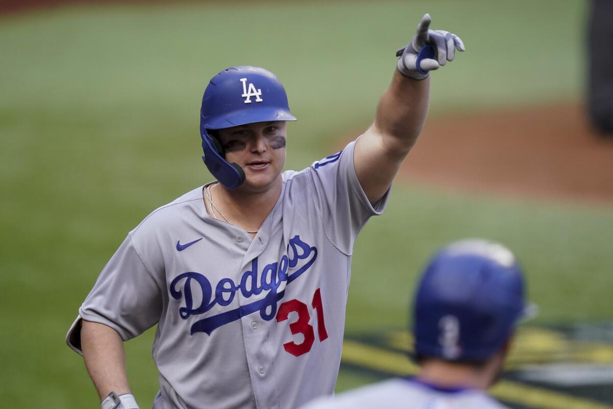 Joc Pederson celebrates a three-run home run during the first inning in Game 3 of the NLCS against the Atlanta Braves.