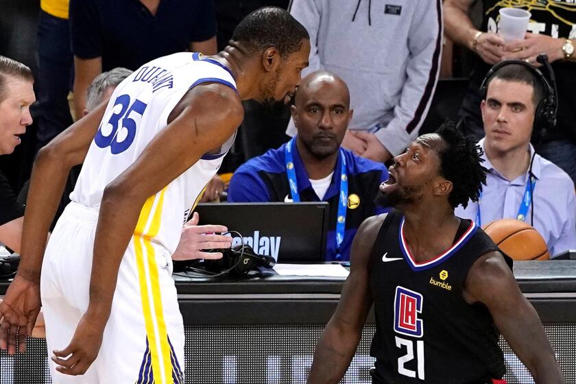 SHUTTERSTOCK OUT Mandatory Credit: Photo by JOHN G MABANGLO/EPA-EFE/REX (10203738a) Golden State Warriors forward Kevin Durant (C) and LA Clippers guard Patrick Beverley (R) exchange words after a play during the second half of the NBA Western Conference Playoffs game one at Oracle Arena in Oakland, California, USA, 13 April 2019. Both players were ejected from the game. Los Angeles Clippers at Golden State Warriors, Oakland, USA - 13 Apr 2019 ** Usable by LA, CT and MoD ONLY **