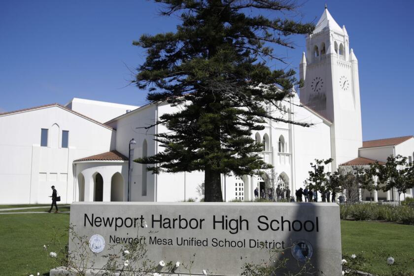 A general view of Newport Harbor High School is shown, Thursday, March 7, 2019, in Newport Beach, Calif. The stepsister of Anne Frank has met with Southern California high school students who were photographed giving Nazi salutes around a swastika formed by drinking cups at a party. Holocaust survivor Eva Schloss spoke to the youths Thursday at Newport Harbor High School in Newport Beach. (AP Photo/Jae C. Hong)