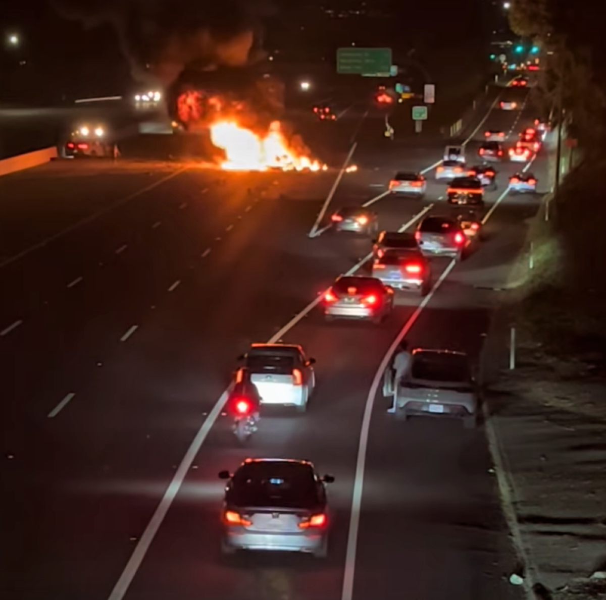 Cars are diverted Sunday off the 73 freeway, where a wrong-way collision resulted in a vehicle fire that killed a driver.