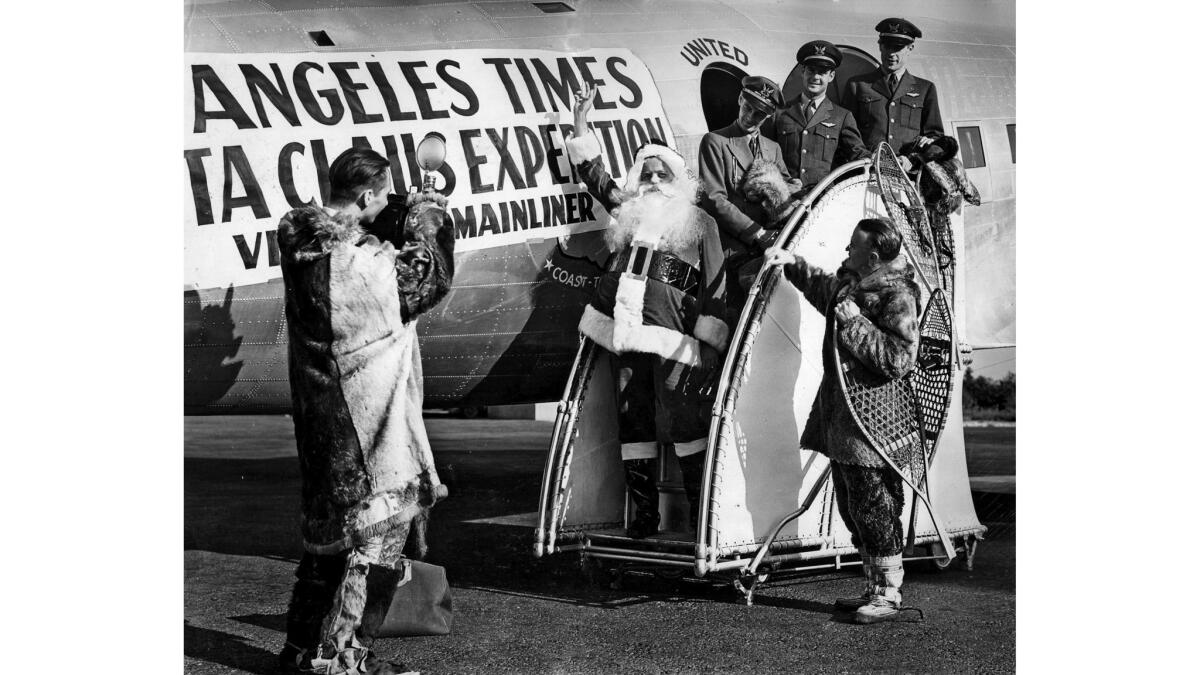Nov. 1938: Santa Claus arrives in Los Angeles from the North Pole after flight on United Airlines.