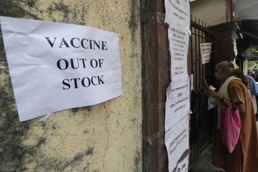 A note informing about the COVID-19 vaccine is seen pasted on a wall of a vaccination centre in Mumbai, India, Thursday, April 8, 2021. India's western Maharashtra state, home to financial capital Mumbai, is the worst-hit and has nearly half of the country new infections in the past week. And now some vaccination centers are turning away people due to a shortage. The state said Wednesday that stocks would run out in three days, promoting an angry denial from India's health minister Harsh Vardhan, who blamed the state for “singularly bogging down the entire country's efforts to fight the virus.” (AP Photo/Rafiq Maqbool)