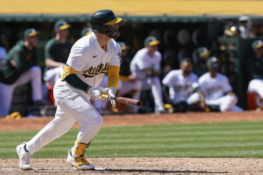 Oakland Athletics' Seth Brown watches his three-run home run during the eighth inning of a baseball game against the Texas Rangers, Tuesday, May 7, 2024, in Oakland, Calif. (AP Photo/Godofredo A. Vásquez)