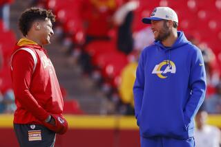 The Chiefs' Patrick Mahomes (left) talks with the Rams' Matthew Stafford before a game in 2022.