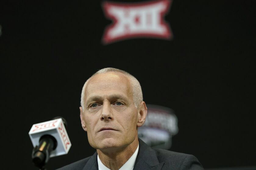 FILE - Then-incoming Big 12 Commissioner Brett Yormark listens during a news conference opening the NCAA college football Big 12 media days in Arlington, Texas, July 13, 2022. Big 12 Commissioner Brett Yormark said expansion remains a focus for the conference that wrapped up its spring meetings Friday, June 2, 2023, with a record revenue distribution of $440 million to split among its 10 current schools.(AP Photo/LM Otero, File)