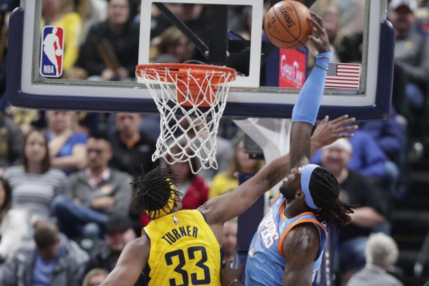 Los Angeles Clippers center DeAndre Jordan (6) is fouled by Indiana Pacers center Myles Turner (33) on a dunk during the second half of an NBA basketball game in Indianapolis, Friday, March 23, 2018. The Pacers defeated the Clippers 109-104. (AP Photo/Michael Conroy)