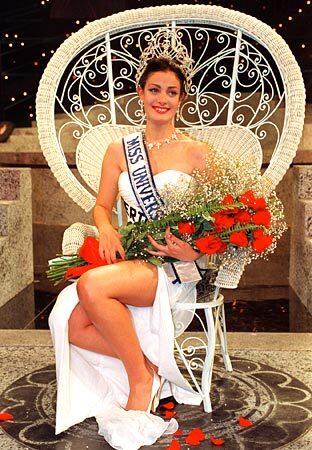 Dayanara Torres of Puerto Rico sits on her throne after winning the 1993 Miss Universe pageant in Mexico City. She went on to sing and act and was briefly married to pop star Marc Antony.