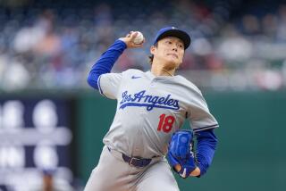 Los Angeles Dodgers pitcher Yoshinobu Yamamoto throws during the third inning of a baseball.