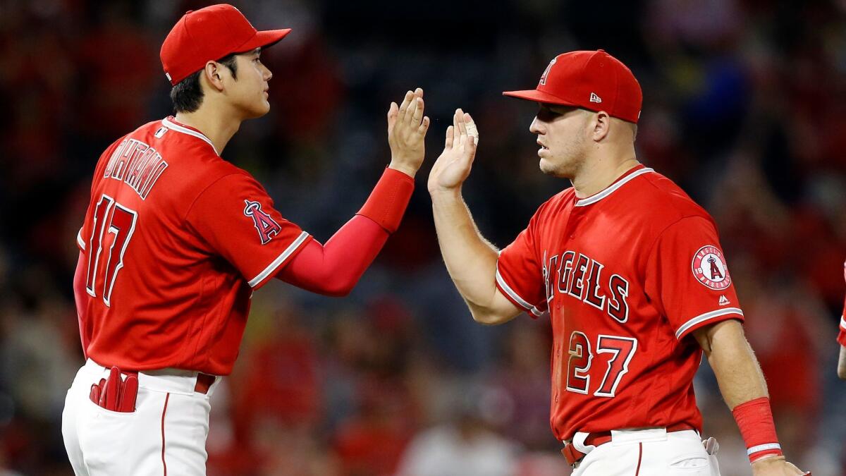 Angels stars Shohei Ohtani, left, and Mike Trout.