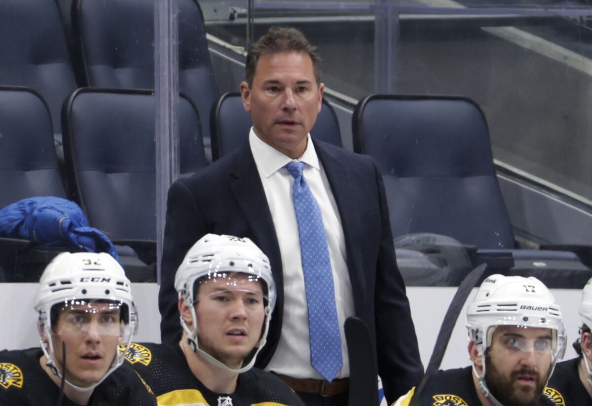 FILE - Boston Bruins coach Bruce Cassidy watches during the third period of the team's NHL hockey game against the New York Islanders on Feb. 17, 2022, in Elmont, N.Y. The Vegas Golden Knights named Cassidy as the team's coach Tuesday, June 14. (AP Photo/Corey Sipkin, File)