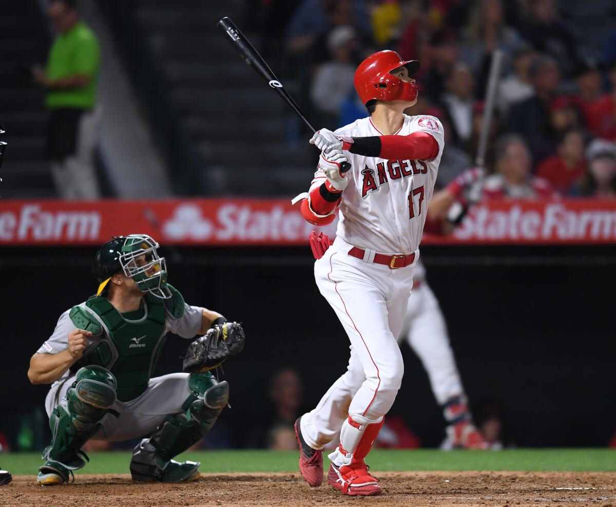 Angels' Shohei Ohtani (17) watches his two run home run, to trail 4-2 to the Oakland Athletics, during the sixth inning at Angel Stadium on Tuesday.