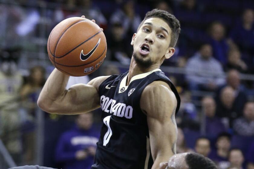 Colorado's Askia Booker drives to the basket during a game against Washington on Jan. 12. Booker has averaged 17 points per game since Buffaloes standout Spencer Dinwiddie's season-ending injury.