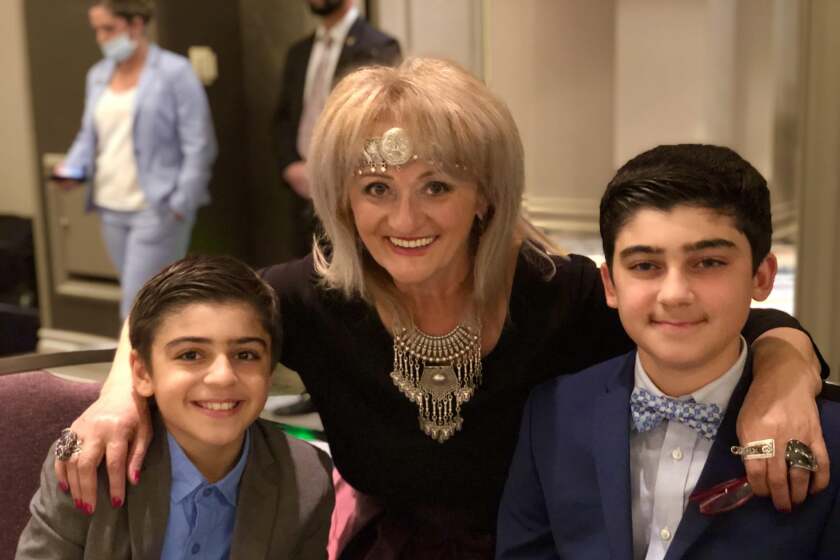 Arno, 13, and Vaugh, 11, Janoyan of Encinitas, pictured with music teacher Sona Baghdasarian (center).