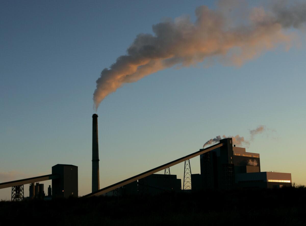 U.S. carbon emissions from the energy sector rose about 2% in 2013 after years of decline because of a small increase in the use of coal to generate electricity, the U.S. Energy Information Administration says. Above, a file photo of a coal-fired power plant in Holcomb, Kan.