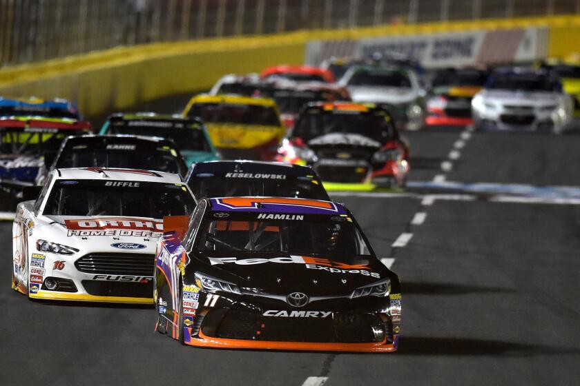 NASCAR driver Denny Hamlin leads the pack during the Sprint All-Star Race at Charlotte Motor Speedway on Saturday night.