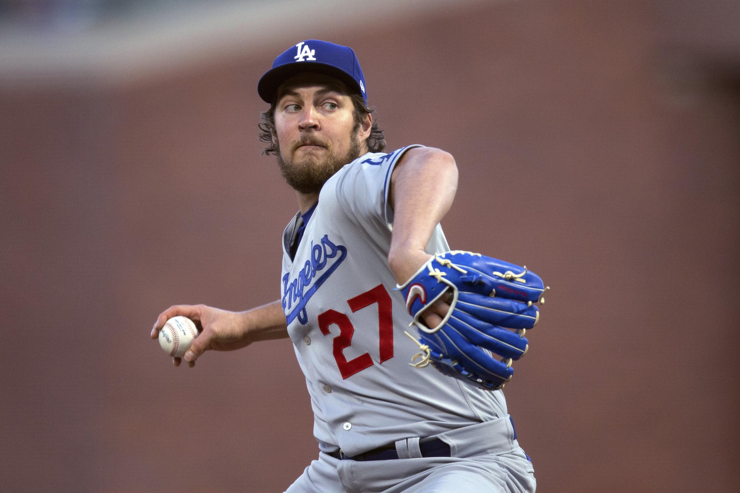 FILE - Los Angeles Dodgers starting pitcher Trevor Bauer works against the San Francisco Giants.