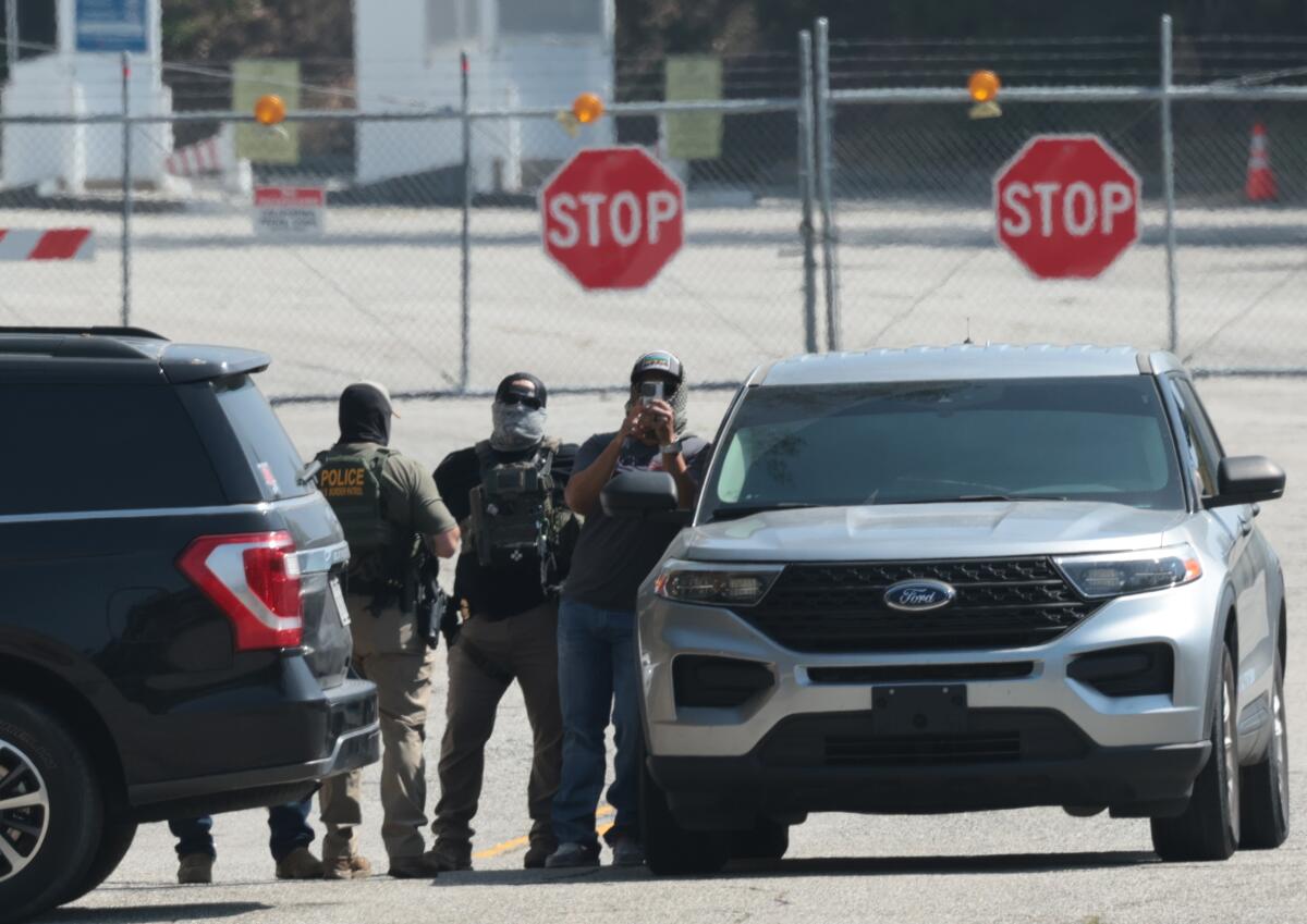 Federal agents stage outside Dodger Stadium