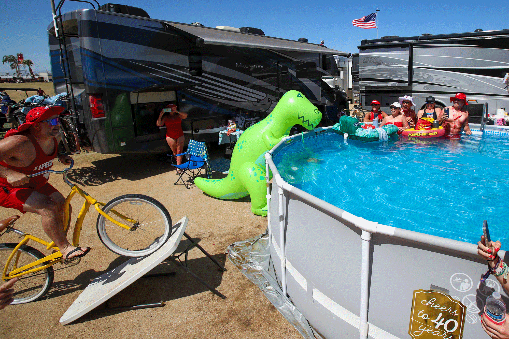 In an animated series of photos, a man rides a bike off an improvised table ramp into a pool at Stagecoach.