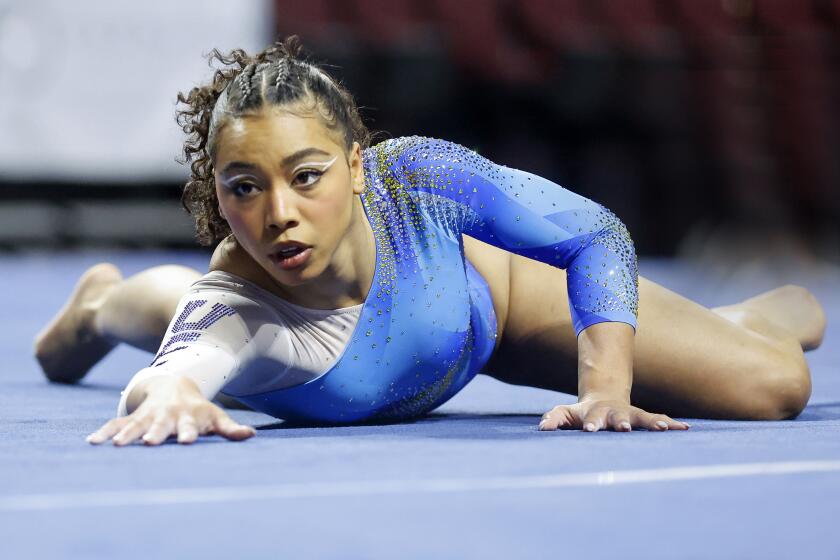UCLA's Margzetta Frazier competes on the floor exercise during an NCAA gymnastics meet