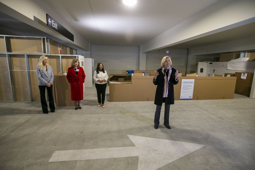 Irvine, CA - March 28: Annette Walker, right, the President of City of Hope Orange County, speaks to members of the media during a tour of a built-to-scale replica of its new specialty cancer hospital in Irvine on Tuesday, March 28, 2023 in Irvine, CA. Also present in the photo is Heidi Paolone, left, Cynthia Powers, and Farrah Khan, the mayor of Irvine. (Scott Smeltzer / Daily Pilot)