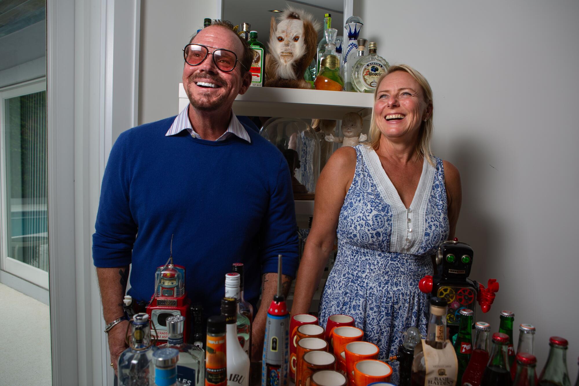 George and Izabela Buff laughing at home in Palm Beach.