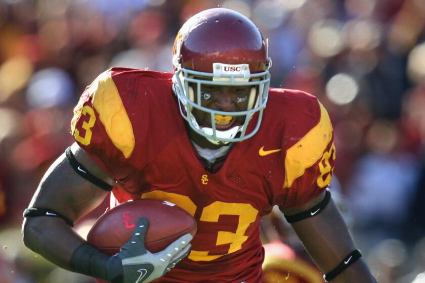USC tight end Fred Davis runs with the ball during a win over UCLA in December 2007.