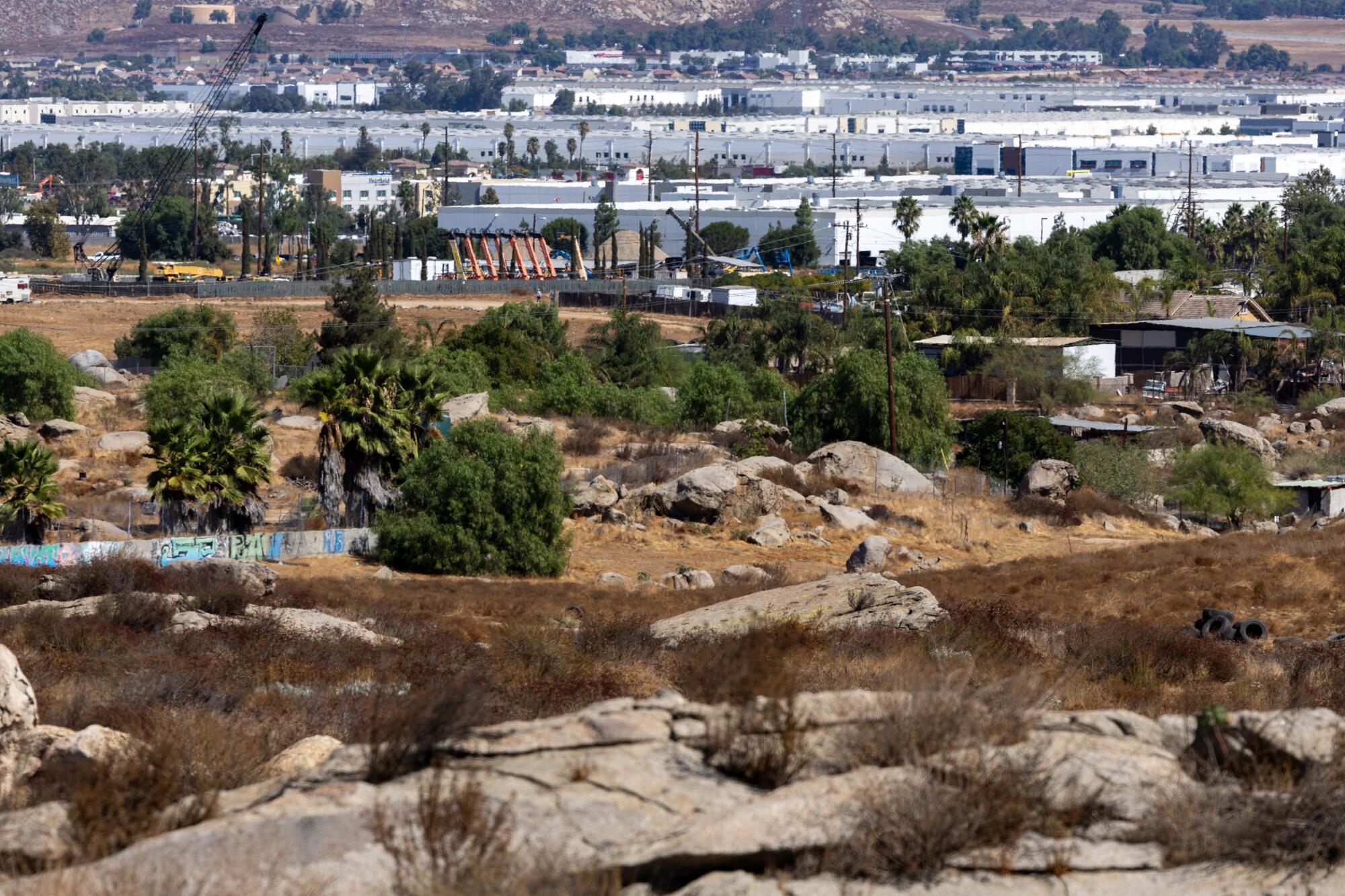 An aerial view of scrub land and open space proposed for warehouse development.