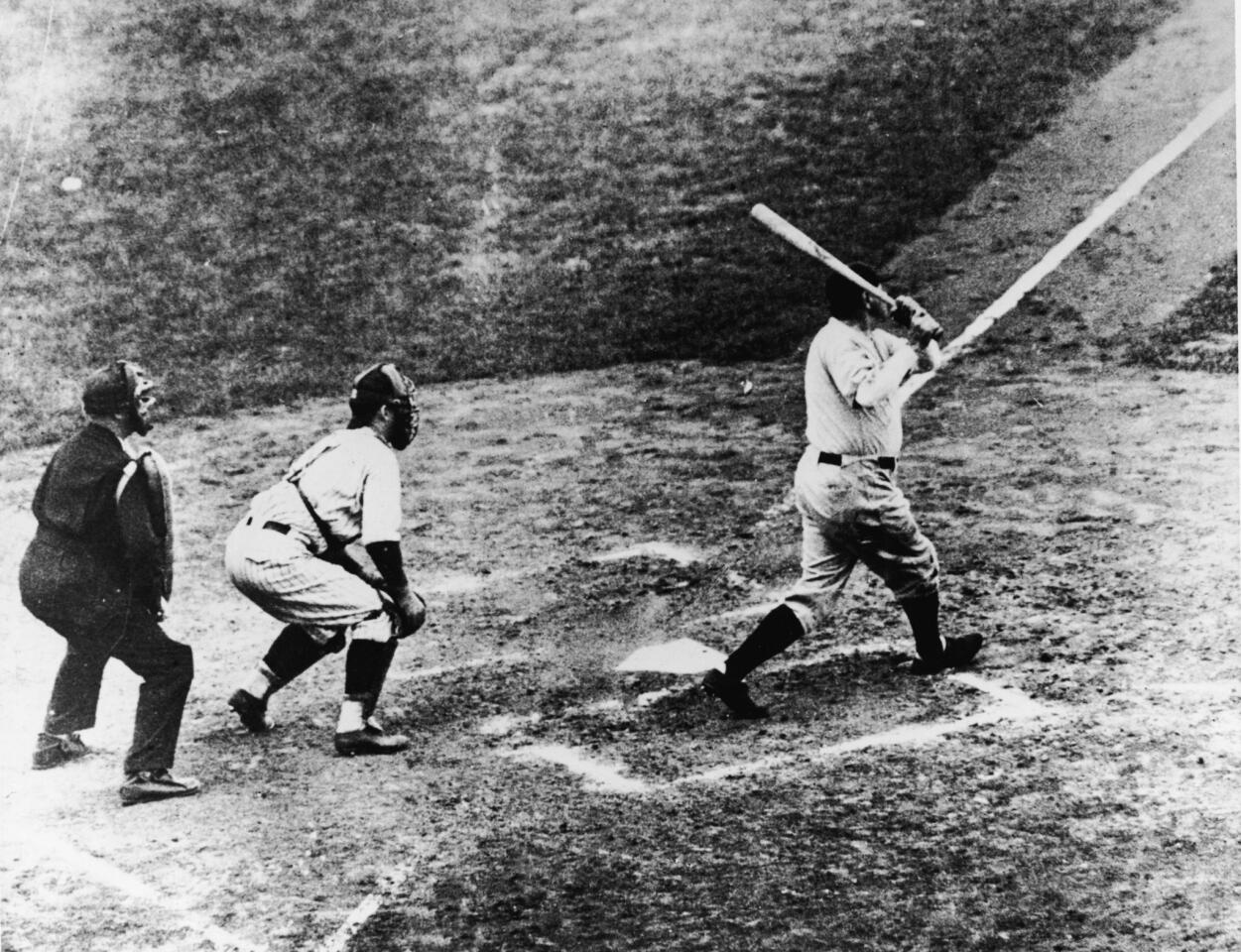 Legendary baseball player Babe Ruth, of the New York Yankees, hits a home run in the third game of the World Series against the Chicago Cubs at Wrigley Field on Oct. 1, 1932. It was during this game that Ruth gestured with his bat before hitting a home run giving birth to the legend of the 'Called Shot.'