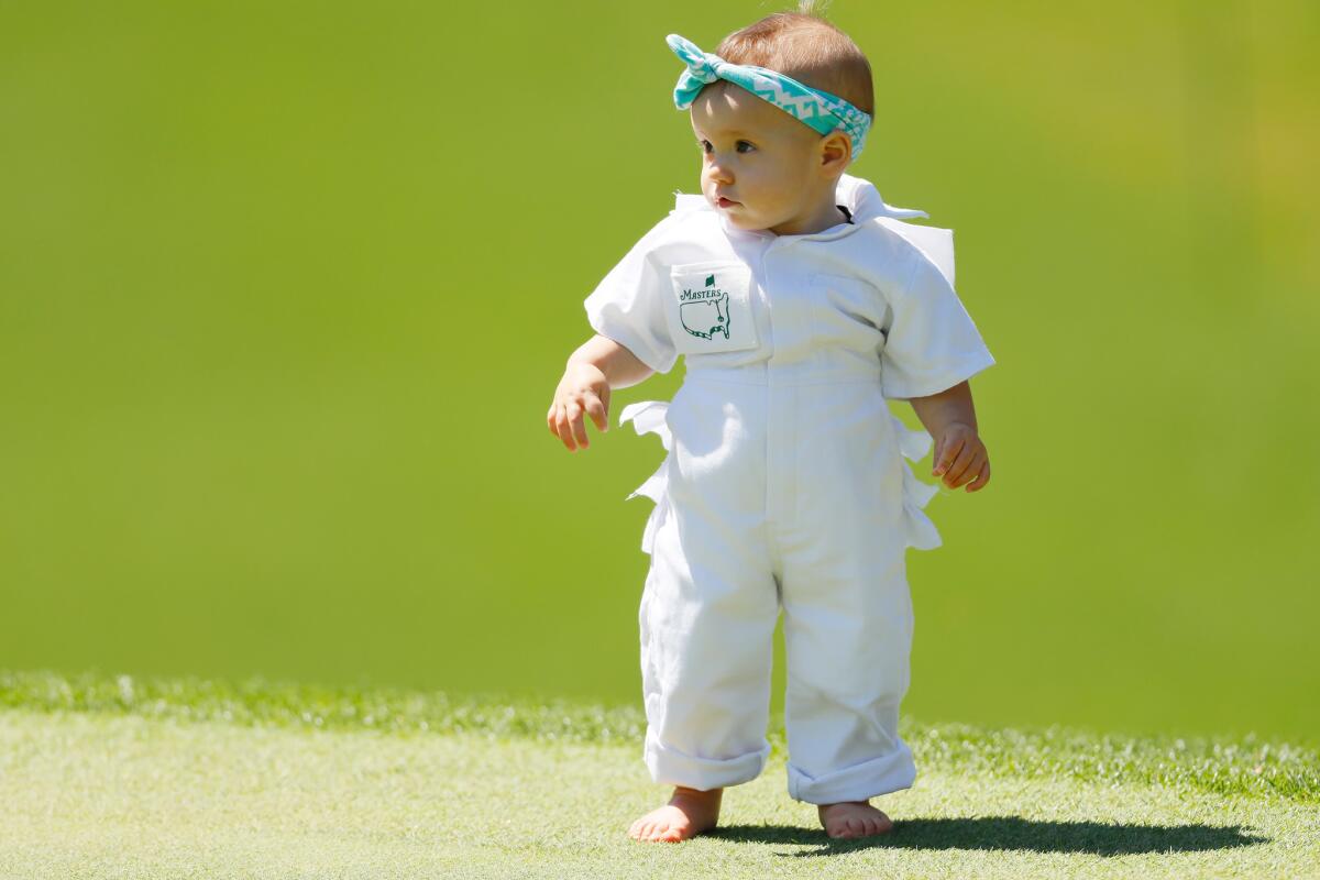 Azalea Adele Garcia, daughter of Sergio Garcia of Spain, looks on during the par-three contest prior to the Masters at Augusta National Golf Club.