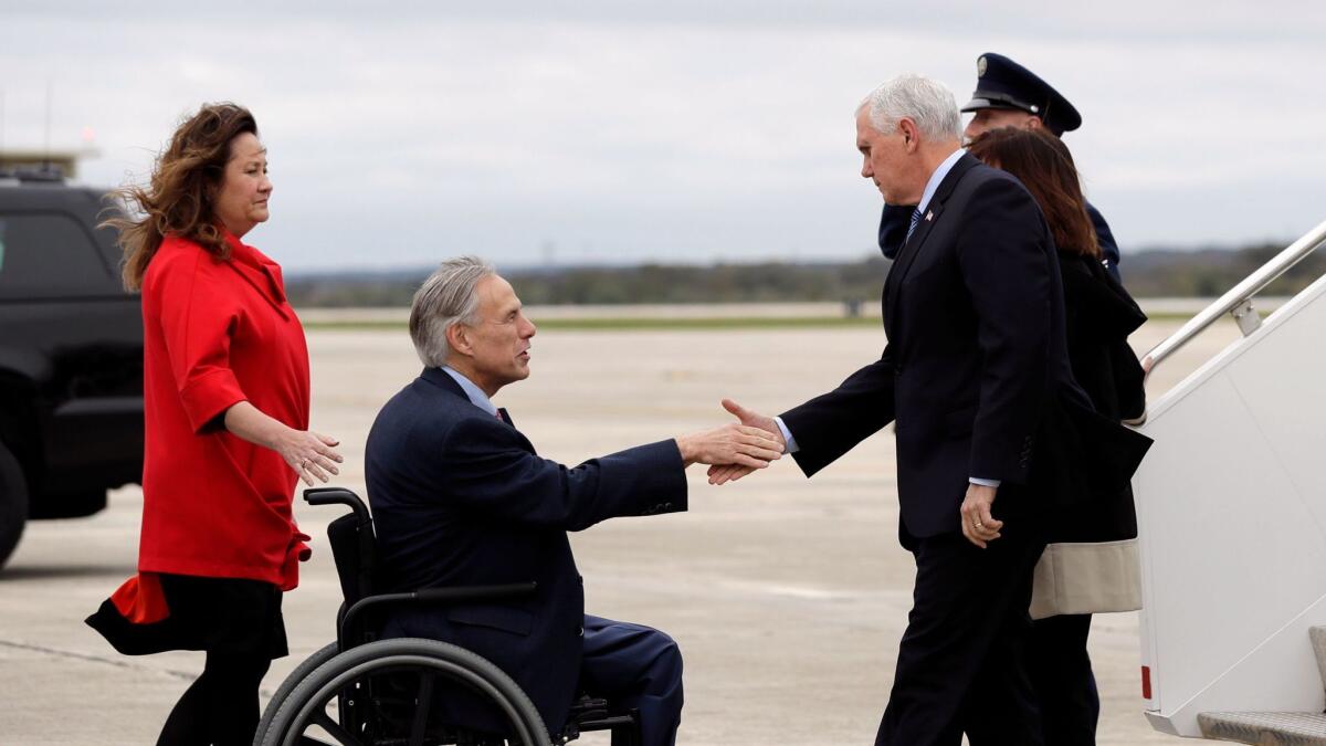 Texas Gov. Greg Abbott and his wife, Cecilia, left, welcome Vice President Mike Pence and his wife, Karen, to San Antonio.