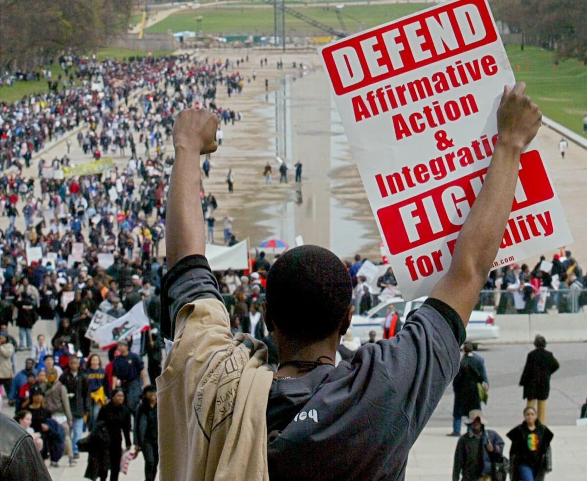 A man stands on the steps of the Lincoln Memorial in Washington, D.C., on April 1, 2003, demonstrating for affirmative action.