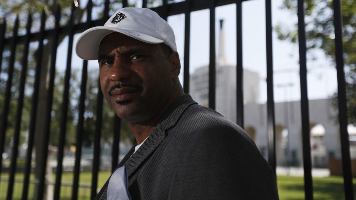 Lloyd Lake stands near the Coliseum on May 31. Though he was at the center of former USC assistant coach Todd McNair's defamation case against the NCAA, Lake did not appear at the trial earlier this month.