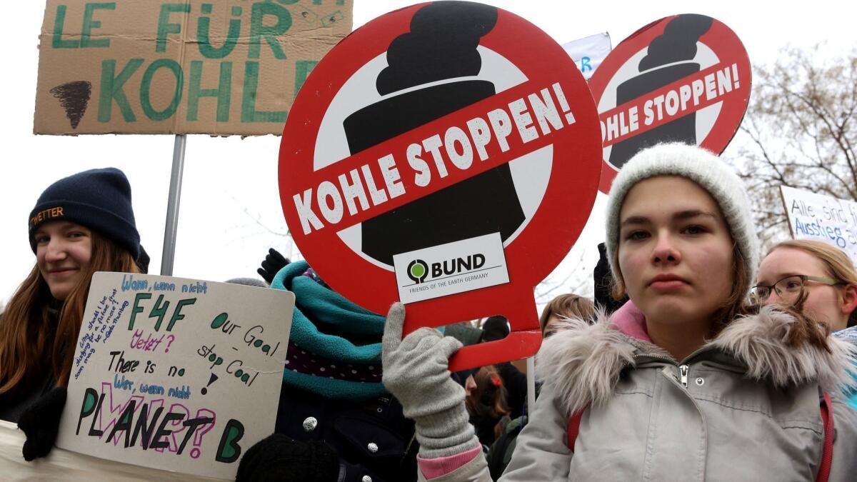 Students demonstrate outside the federal chancellery during a meeting of the country's coal commission in Berlin on Friday.