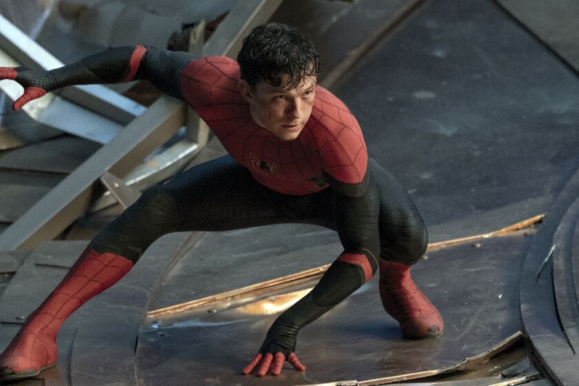 A man in a Spider-Man costume crouching in a fighting stance
