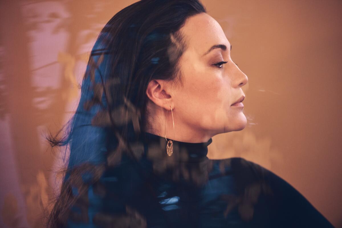 A photo of Lily Gladstone in profile.