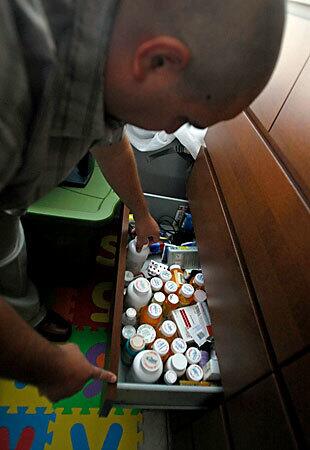 Former Army Spc. Michael Butcher, 29, sorts through the 2 dozen medications he uses to help cope with disabilities related to combat injuries sustained in Iraq. When he tells employers he needs time off to see therapists for post-traumatic stress disorder and a brain injury, they don't call back.