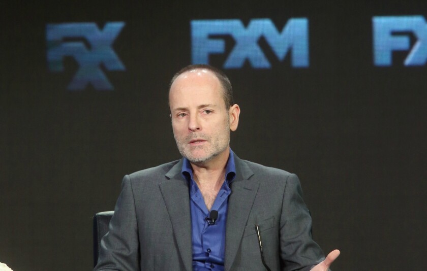 FX Chief Executive John Landgraf speaks at the Television Critics Assn. gathering in Pasadena on Saturday.