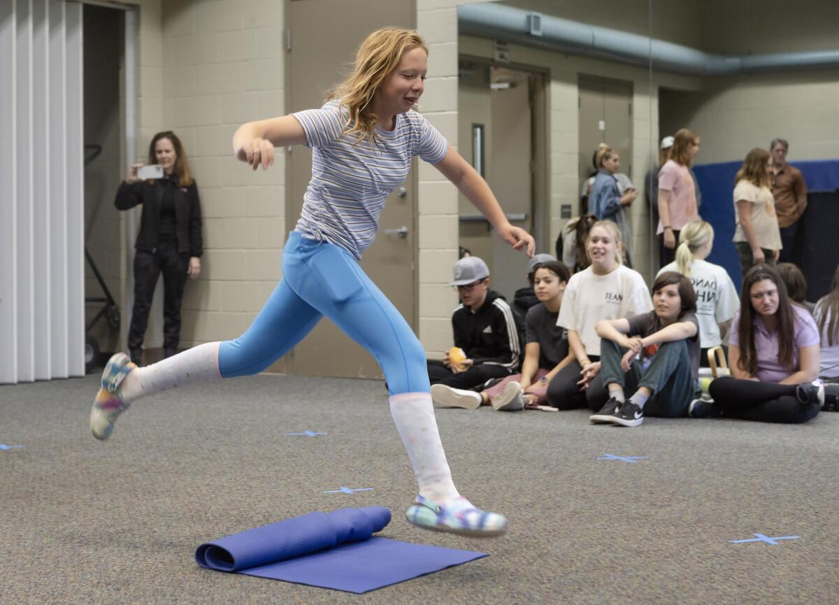 Cassidy Stokes participates in a dance class lead by members of the Newport Harbor Dance Team.