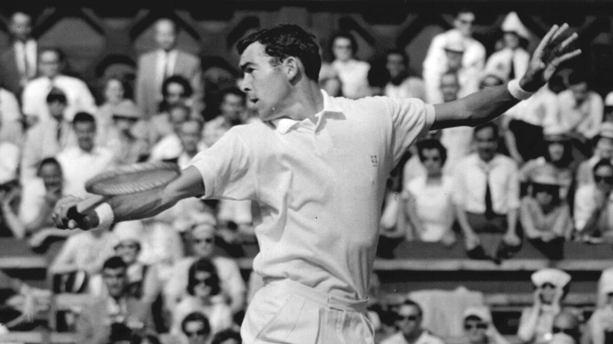 Mike Davies in action against G Mulloy at Wimbledon Tennis Championship in 1960.