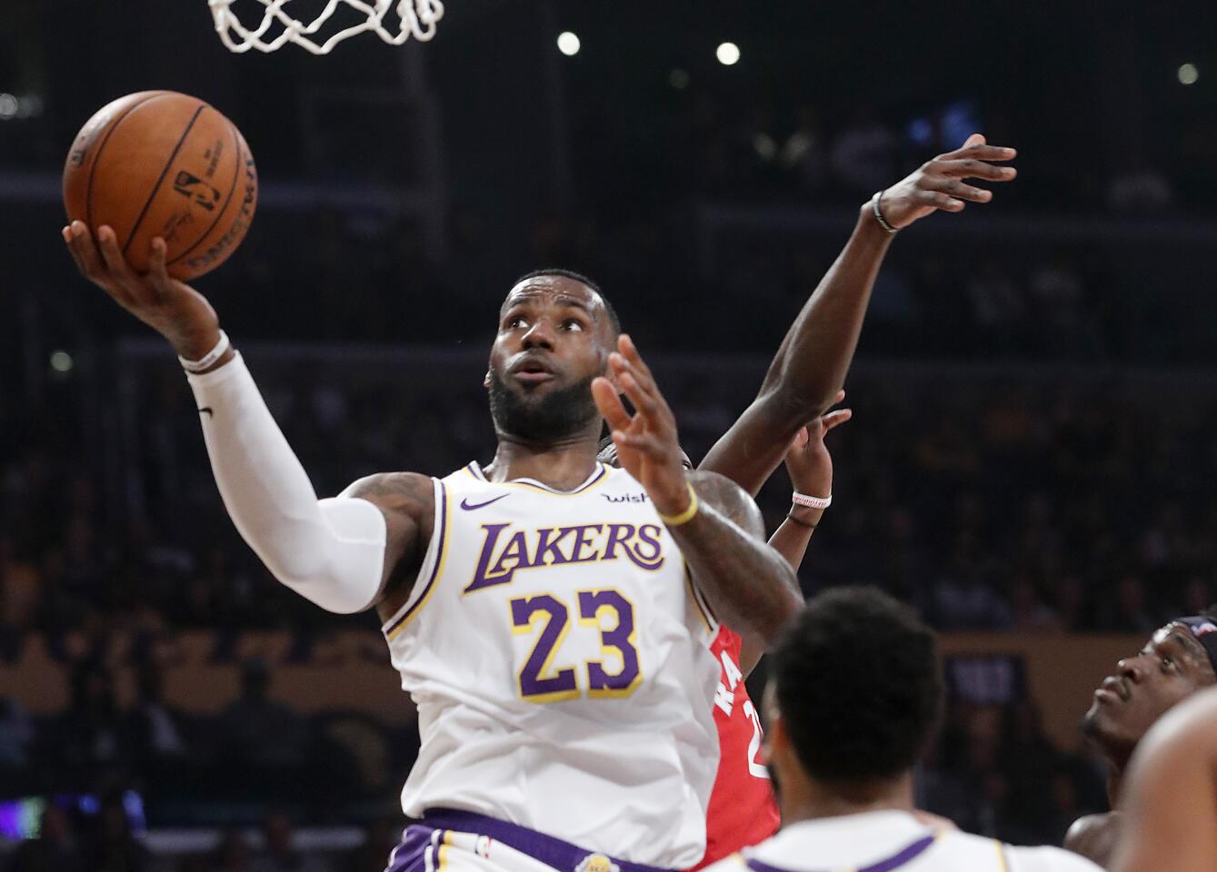 LOS ANGELES, CALIF. - NOV. 10, 2019. Lakers forward LeBron James drives to basket against the Raptors in the first quarter at Staples Center in Los Angeles on Sunday night, Nov. 10, 2019. (Luis Sinco/Los Angeles Times)