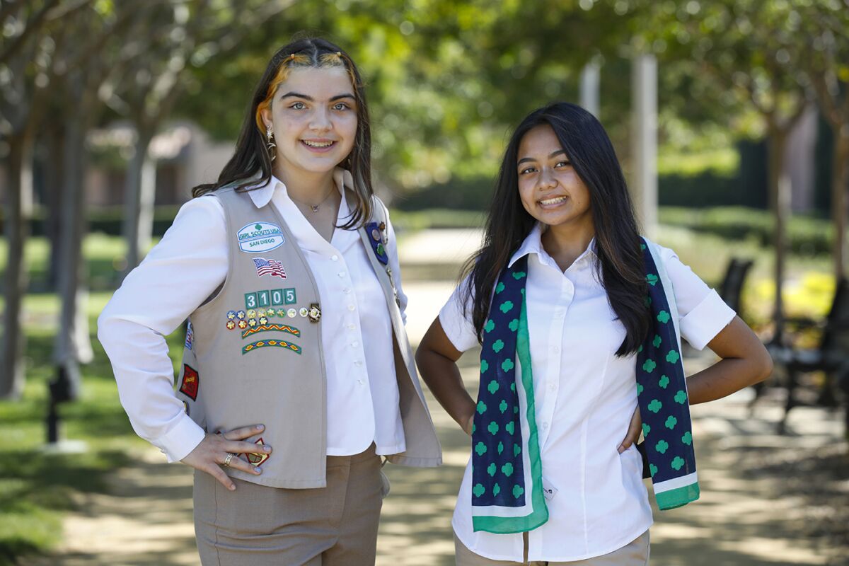 Girl Scouts Kristine Mackey (they/them), left, and Carolaina Ecija, right, were presented with the prestigious Gold Award.