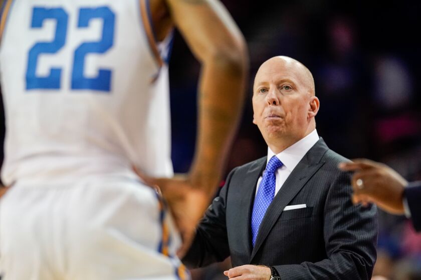 UCLA head coach Mick Cronin looks at forward Shareef O'Neal (22) during the first half of a game against Long Beach State on Nov. 6 at Pauley Pavilion.